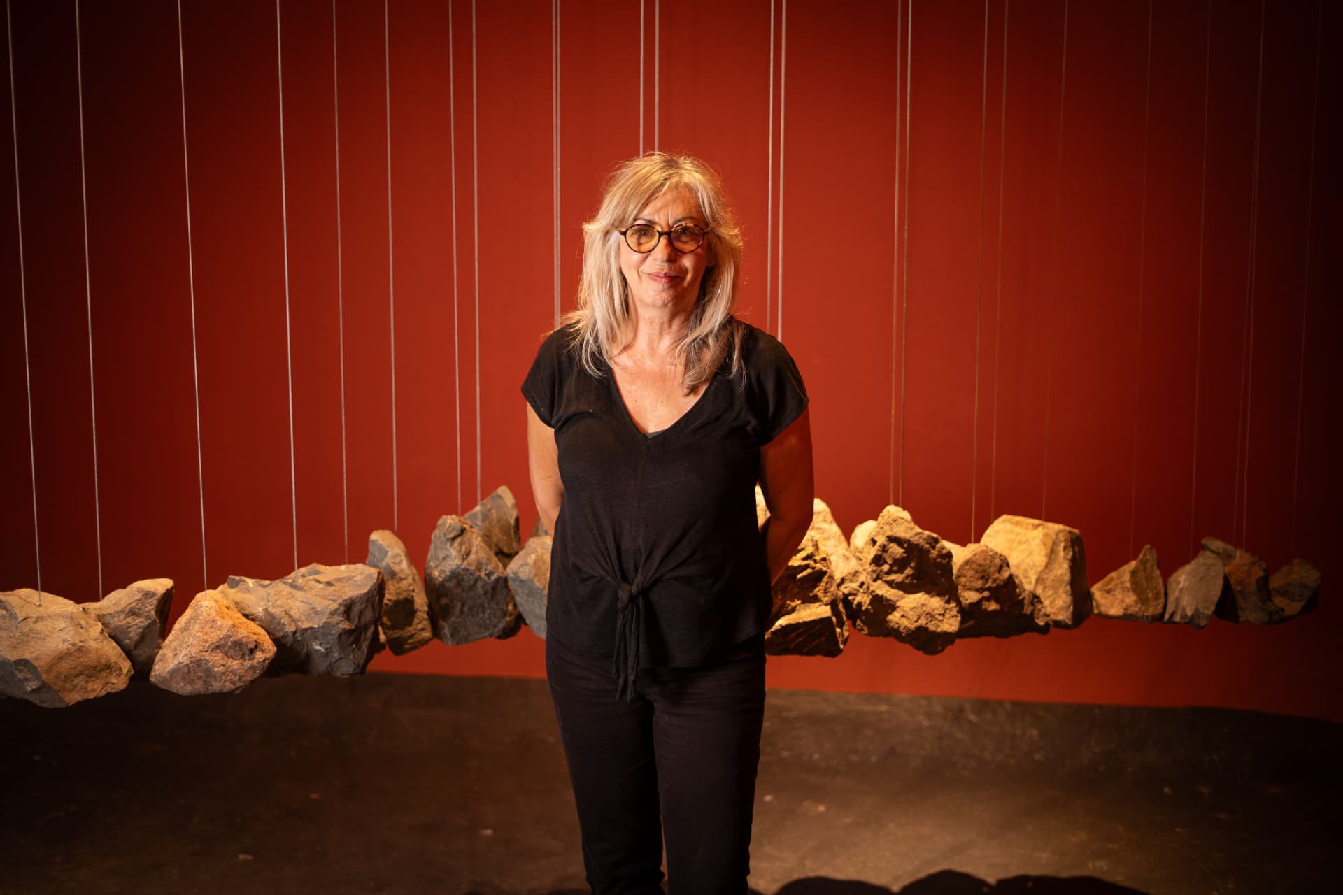 Pamen Pereyra with her installation of suspended stones